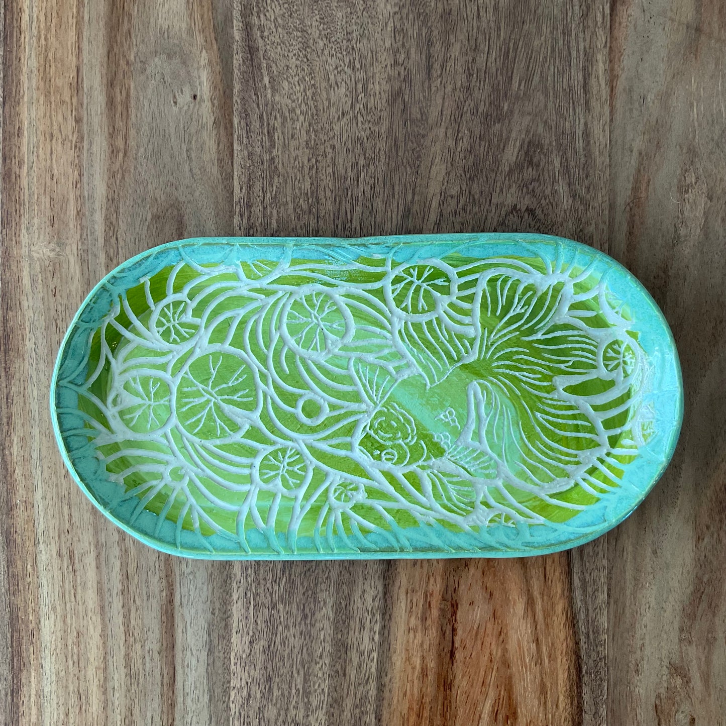 Oranda fish and lily pad sgraffito tray