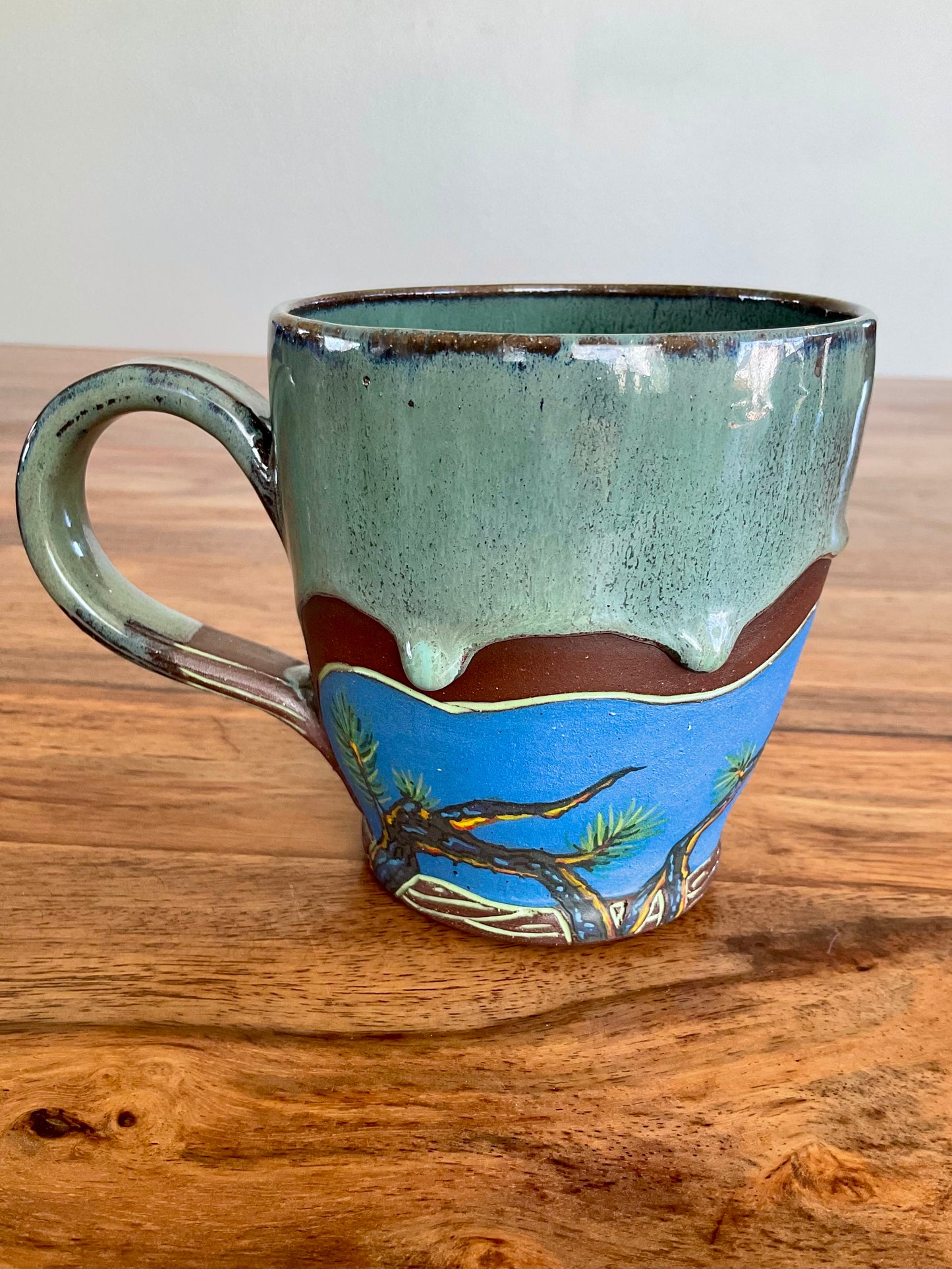 Cute raccoon and pine forest mug