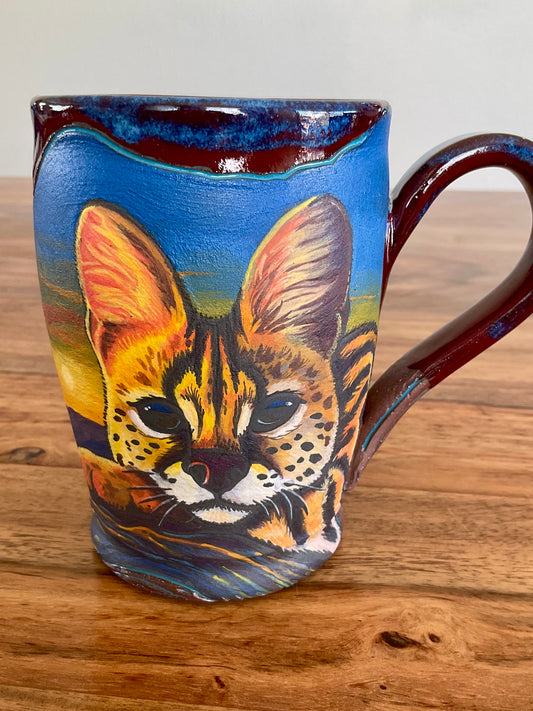 Serval cat and sunset desert mug